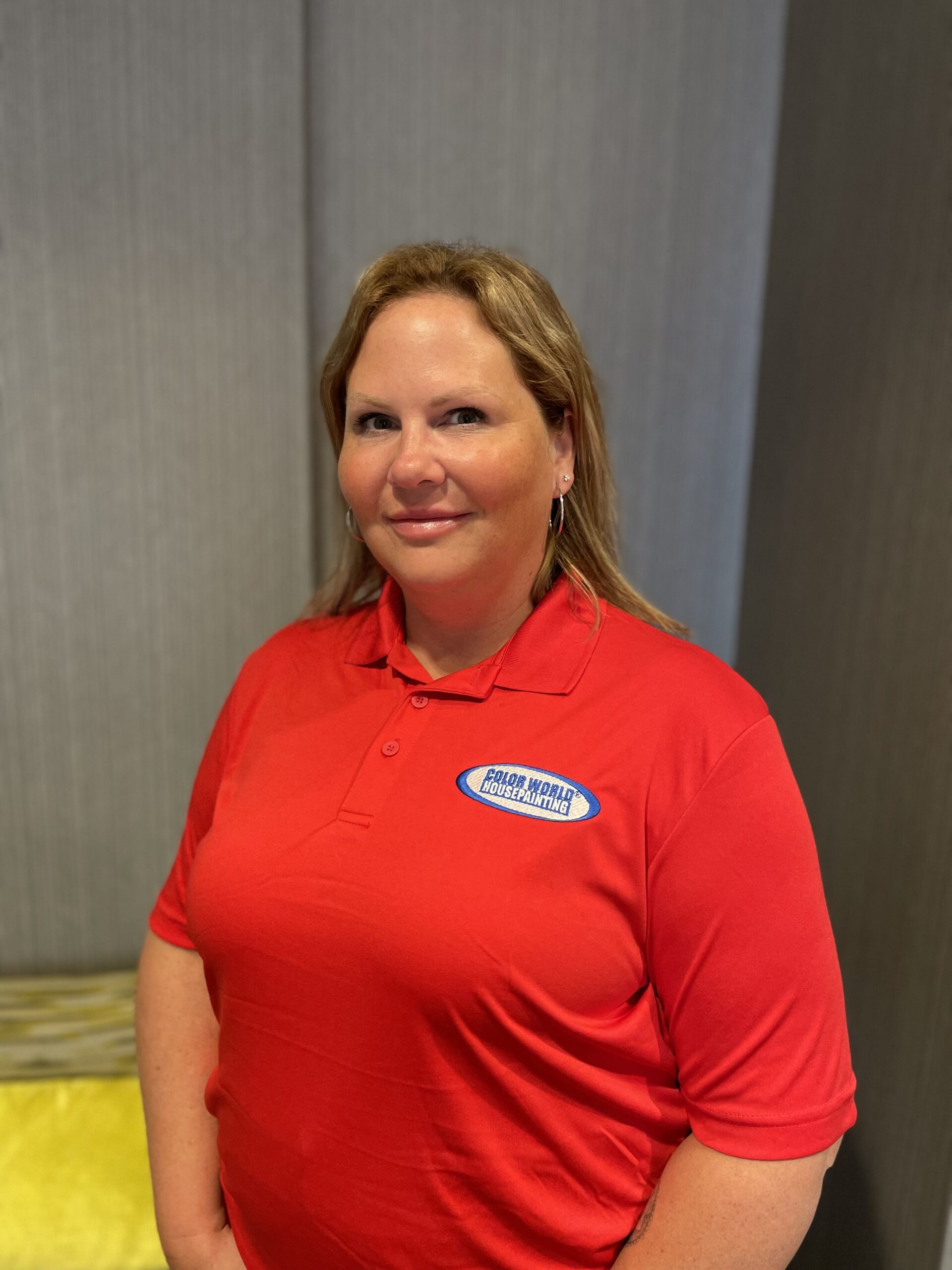 a women wearing a red shirt smiling